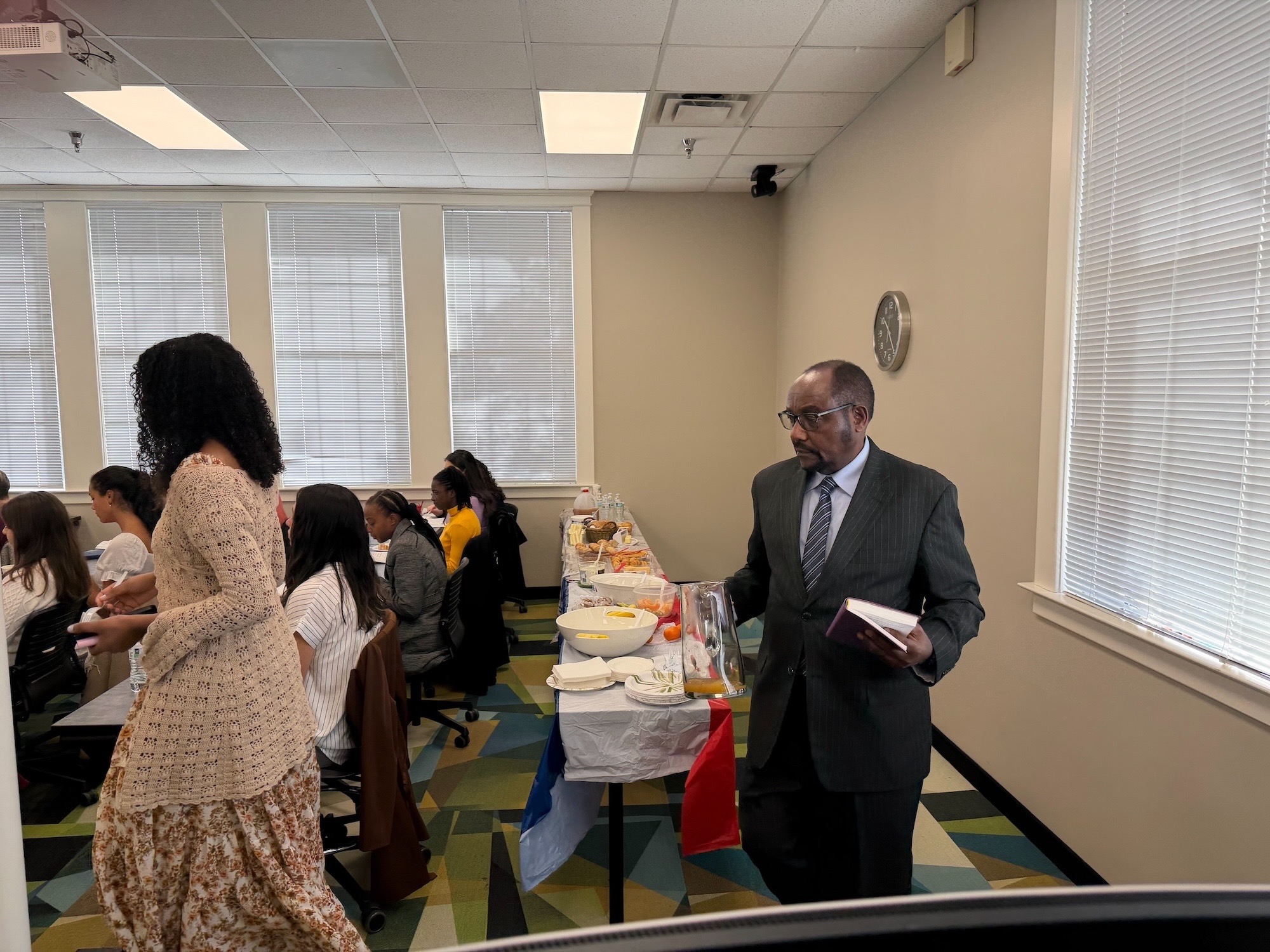 Group attending a Sabbath School discussion in a classroom