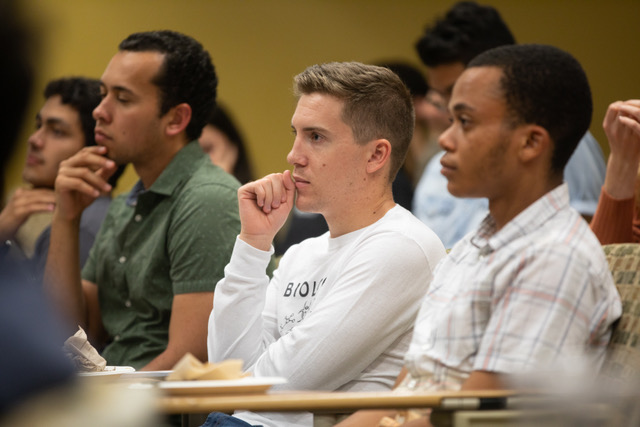 Shows Scholars Students at an event. 