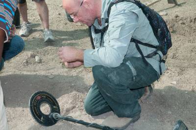 someone working with a metal detector 