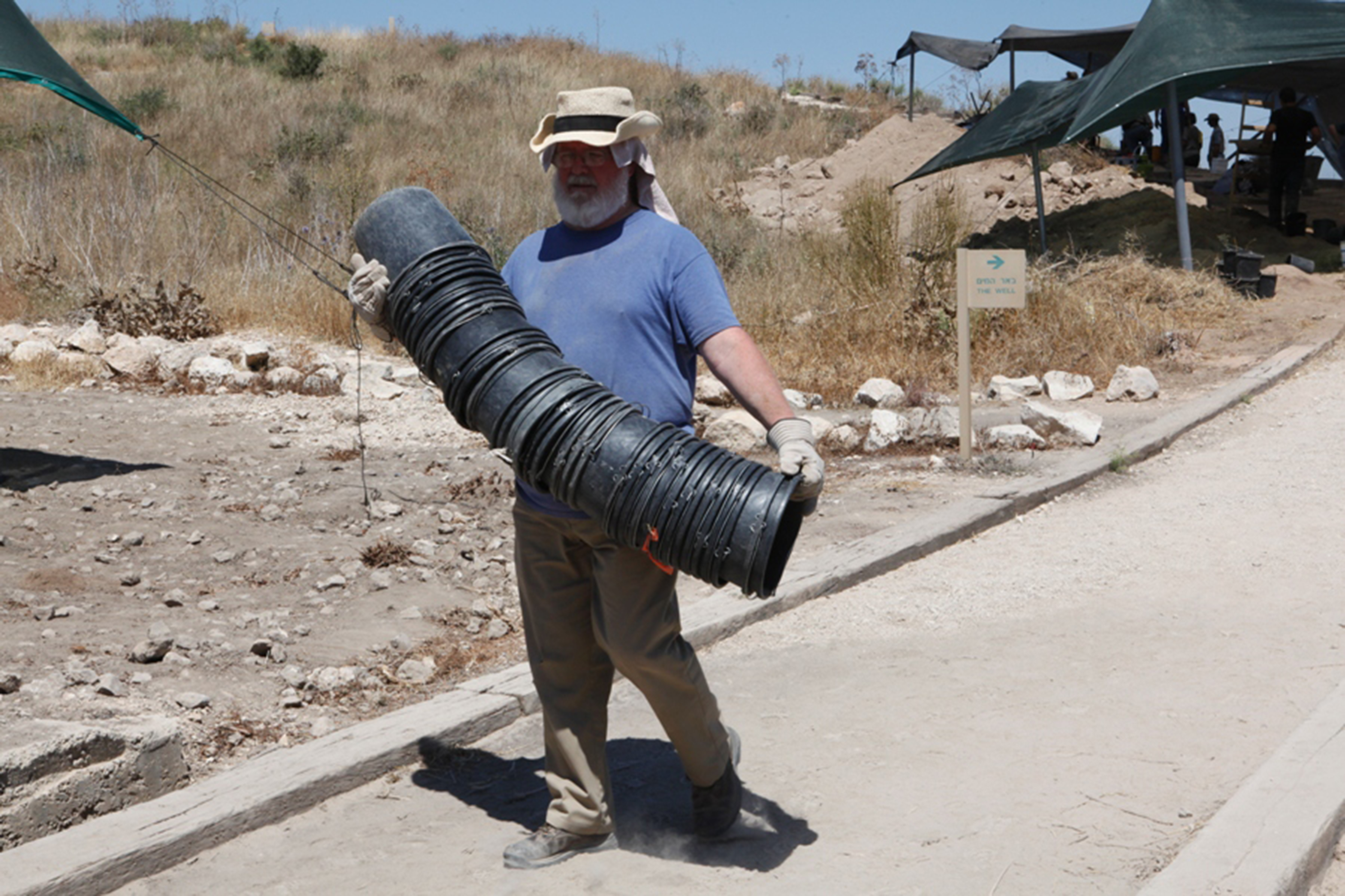 someone holding many buckets