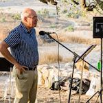 Man speaking into a microphone