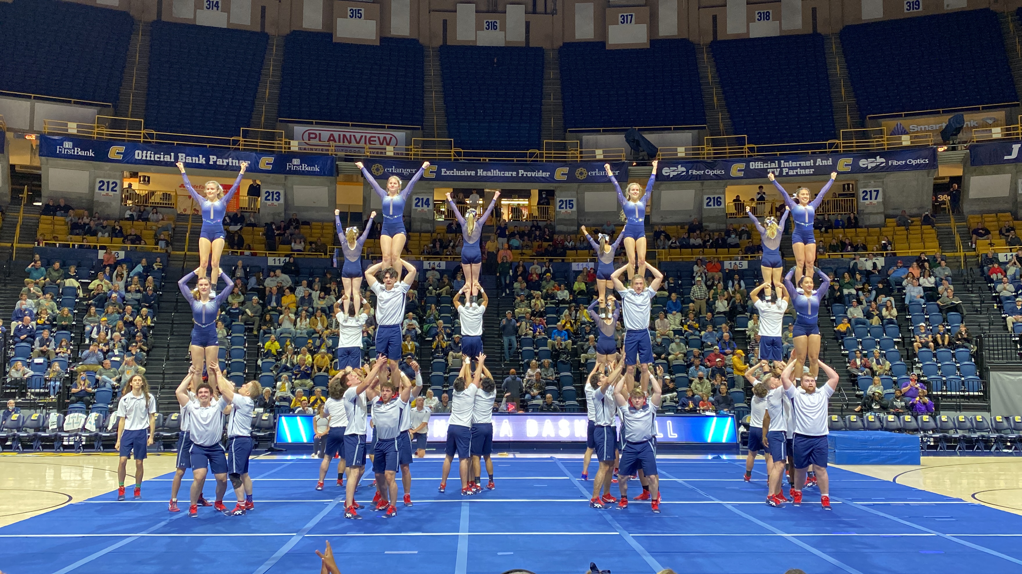 Gym-Masters doing group balances in a venue