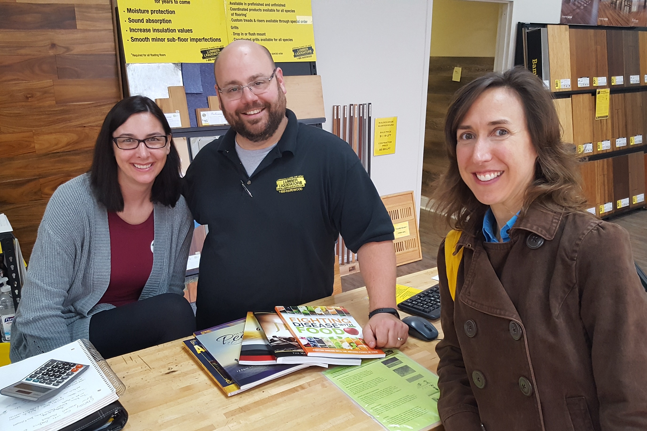 Three people smiling for a photo