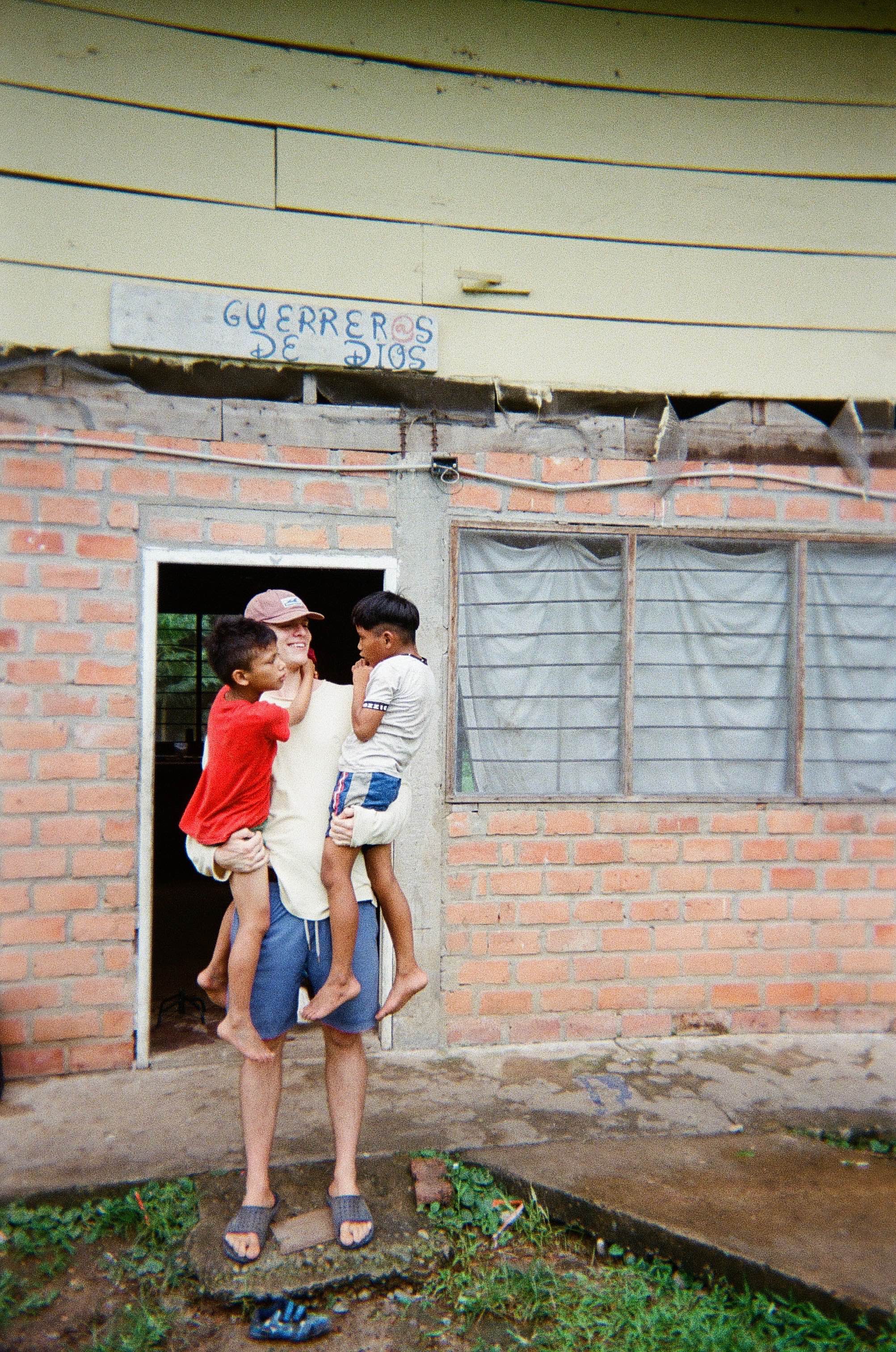 Missionary with local boys in Bolivia 