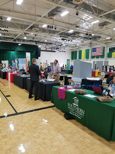 A view of one of the rows of tables at Meet the Firms