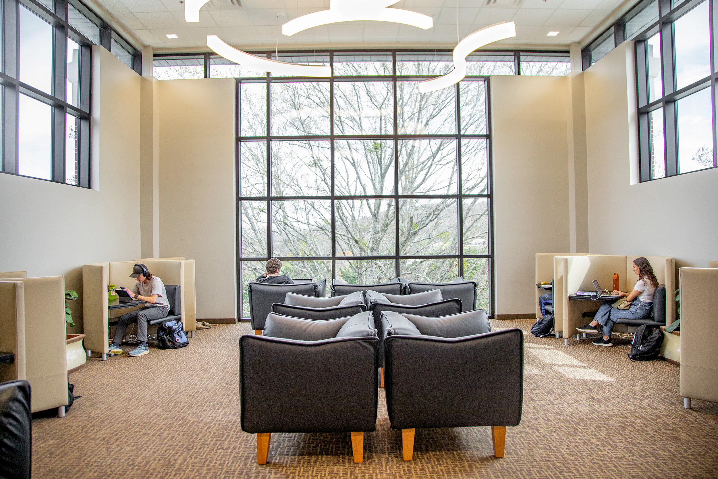 The new reading room on the second floor of McKee Library provides plush chairs and a quiet, light-filled space for students.