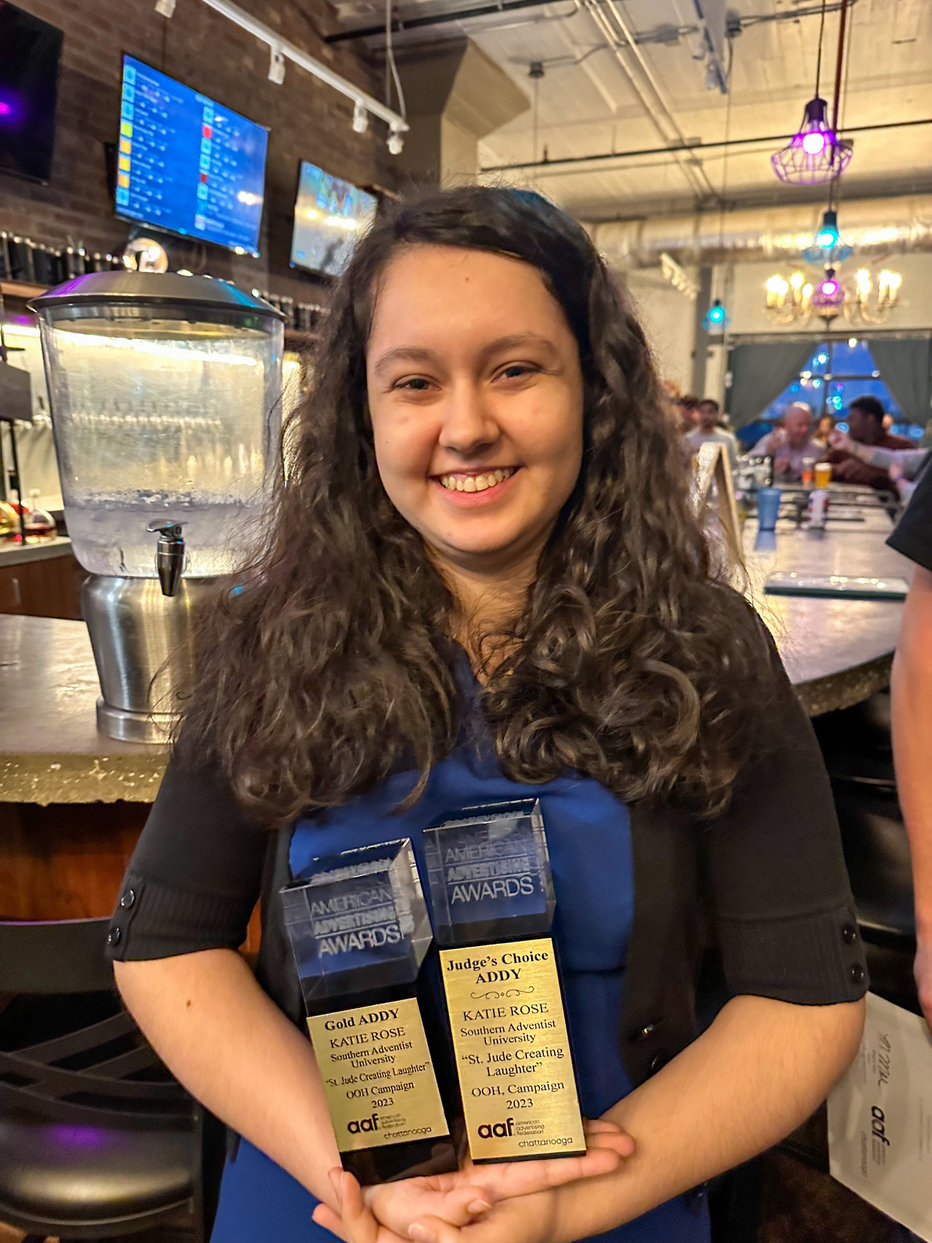 Student winning two awards in event