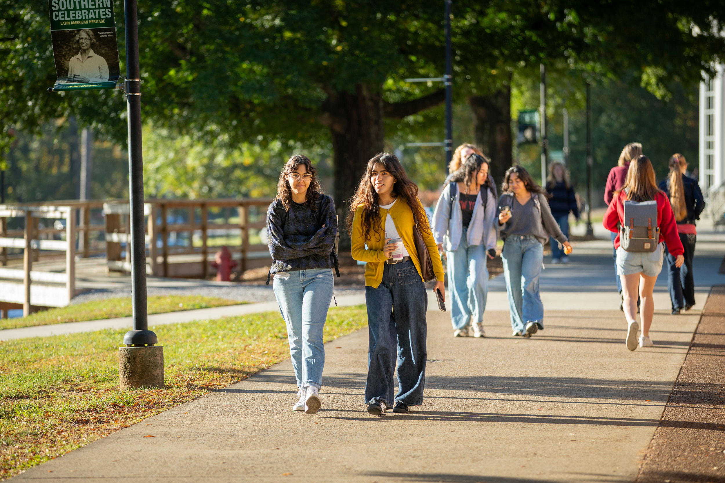 students walk on the promenade